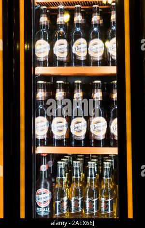 Istanbul, Turkey - December 10 , 2019 : Famous Turkis Beer Bomonti with Miller bottled beers are in a beverage refrigerator. Stock Photo