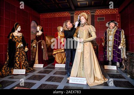 Life size mannequins of the six wives of King Henry VIII are gently brushed and cleaned as part of the cleaning and maintenance of exhibitions at Sudeley Castle in Winchcombe, Gloucestershire. Katherine Parr, the last and surviving wife of King Henry VIII, lived, died and is buried within the grounds of the castle. Stock Photo