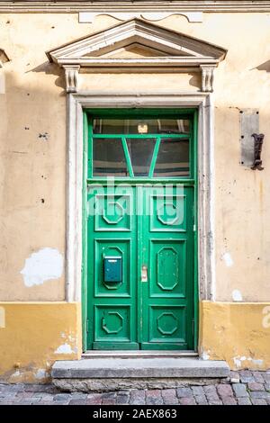 Wooden beautifully colored and decorated old door in Tallinn, Estonia. Stock Photo