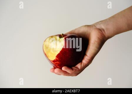 Big red apple in woman hand. Dieting and weight loss concept Stock Photo