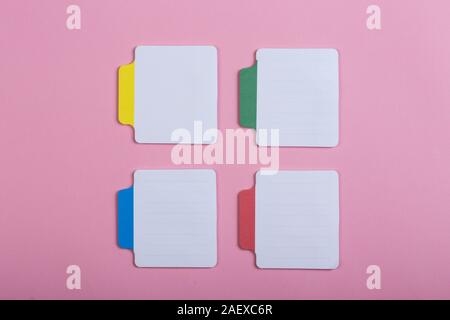 Many colorful sticky note on pink background. Copy space Stock Photo