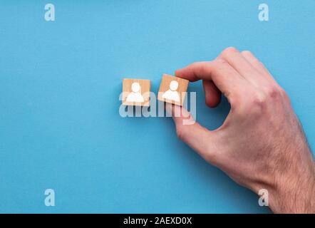 Hand choosing one person from another. Business choice concept Stock Photo