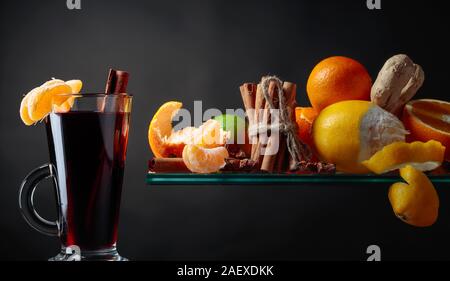 Mulled wine hot drink with citrus and spices. Copy space for your content. Stock Photo
