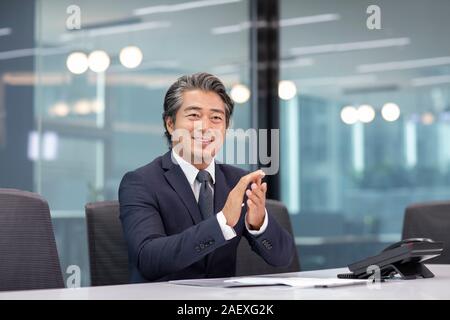 Successful businessman in meeting room Stock Photo