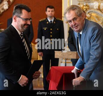 Prague, Czech Republic. 11th Dec, 2019. Czech President Milos Zeman, right, names Lubos Dorfl, left, the chairman of the Prague High Court, on December 11, 2019, in Prague, Czech Republic. Credit: Michal Krumphanzl/CTK Photo/Alamy Live News Stock Photo