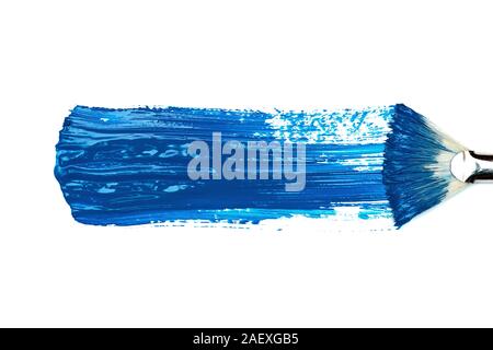 Classic Blue. Color of the Year 2020. Brush stroke of blue paint on white paper. Stock Photo