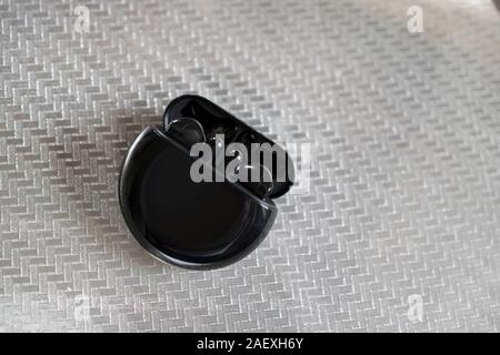 Belgrade, Serbia – November 18th, 2019: Huawei FreeBuds 3 headphones in black color Stock Photo