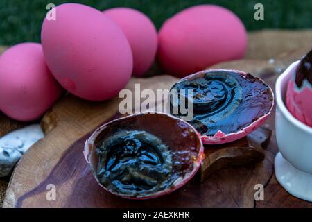 Asian Traditional Food, Pink Century eggs (Pidan Eggs) also known as preserved egg, hundred-year egg, thousand-year egg are a Chinese preserved food p Stock Photo