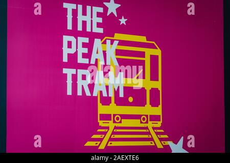 HongKong - November, 2019: Signboard of the Peak Tram logo at train station at Garden Road in Hong Kong. The  train carries tourists to Victoria Peak Stock Photo