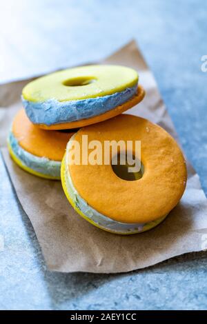 Homemade Colorful Ice Cream Cookie Sandwich Donuts with Blue Italian Caramel. Ready to Eat. Stock Photo