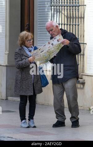 Senior couple reading road map, Antequera, Andalusia, Spain Stock Photo