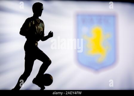 LONDON, ENGLAND, JULY. 1. 2019: Aston Villa Football club logo, Premier League, England. Soccer player silhouette. Stock Photo