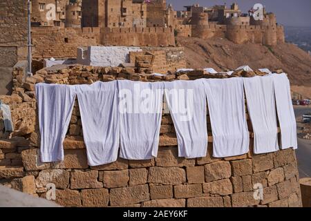 Washing hanging out to dry in the strong sun of Jaisalmer Stock Photo