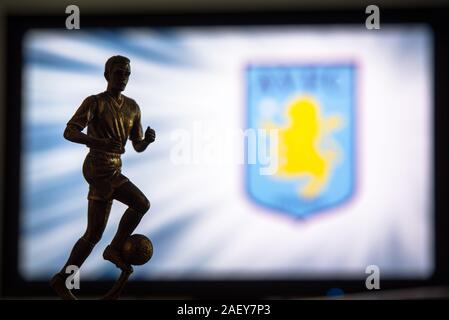 LONDON, ENGLAND, JULY. 1. 2019: Aston Villa Football club logo, Premier League, England. Soccer player silhouette. Stock Photo