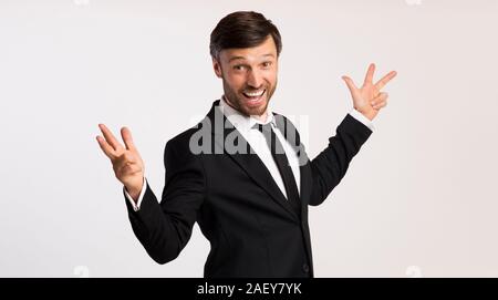 Successful Business People. Happy Businessman Shouting Spreading Hands Standing Over White Studio Background. Panorama Stock Photo