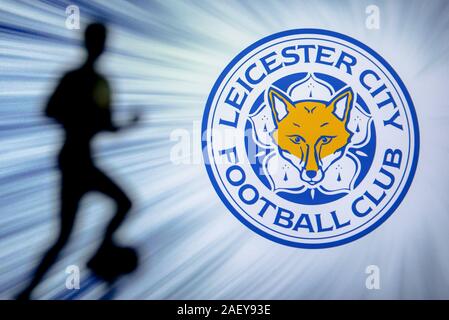 LONDON, ENGLAND, JULY. 1. 2019: Leicester City Football club logo, Premier League, England. Soccer player silhouette. Stock Photo