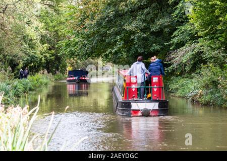 Bradford on Avon, UK, 6th October 2019.  2 barges about to pass each other on the Kennet and Avon canal with boat on left in focus Stock Photo