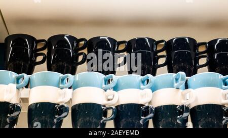 A large set of mugs. Blue, black and white Stock Photo