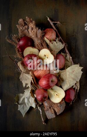 autumnal background  with dried  leaves and red apples Stock Photo