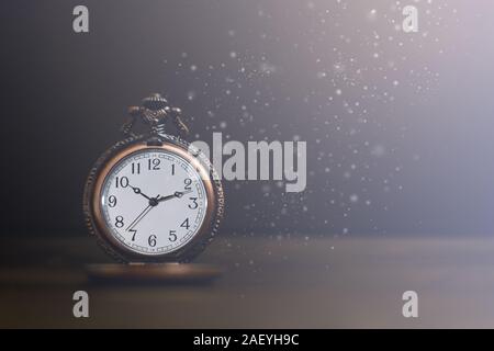 Old pocket watch on dark background Stock Photo