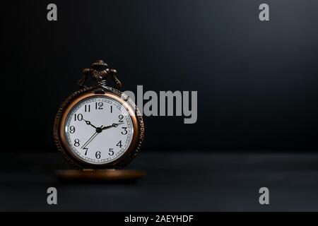 Old pocket watch on dark background Stock Photo
