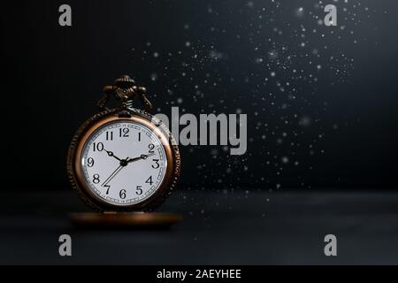 Old pocket watch on dark background Stock Photo