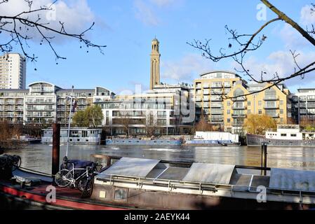 Looking across the River Thames to modern apartment blocks on the riverside at Brentford West London England UK Stock Photo