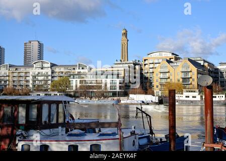 Looking across the River Thames to modern apartment blocks on the riverside at Brentford West London England UK Stock Photo