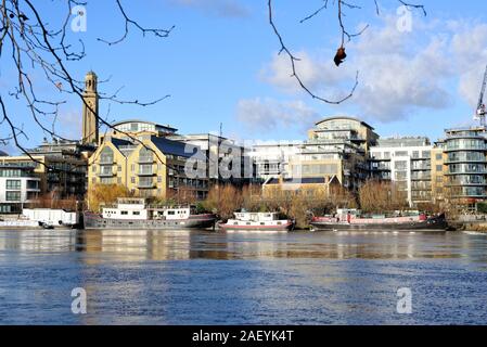 Looking across the River Thames to modern apartment blocks on the riverside at Brentford West London England UK Stock Photo