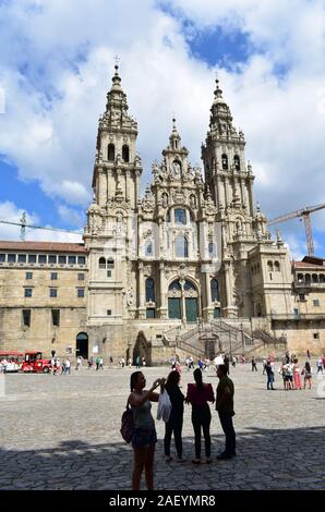 Pilgrims taking pictures in front of Cathedral at Praza do Obradoiro. Santiago de Compostela, Spain. Aug 4, 2019.