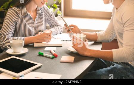 Business research. Young team analyzing marketing data in cafe, empty space Stock Photo