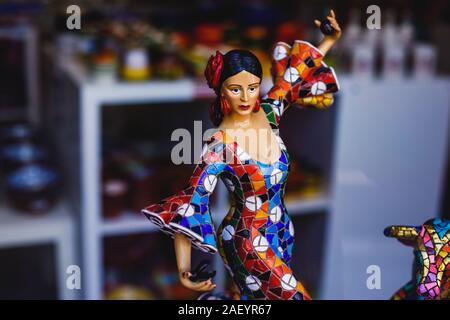 View Of Traditional Tourist Souvenirs And Gifts From Spain, Alicante,  Valencia With Toys, Bull Figures, Flamenco Dancer Dolls, Fridge Magnets  With And Key Ring Keychain, In Local Vendor Souvenir Shop Stock Photo