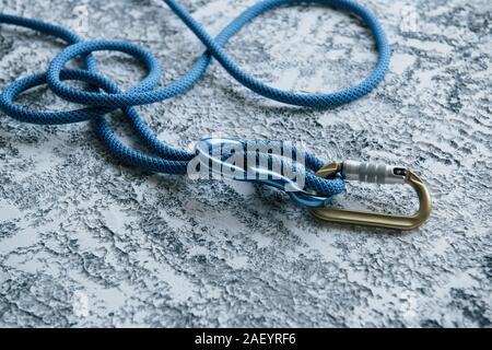 This is for protection. Knot with metal carabiner. Silver colored device for the active sports Stock Photo