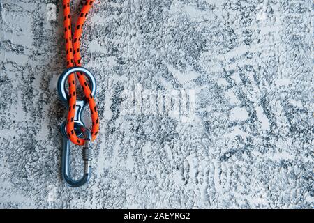 Knot with metal carabiner. Silver colored device for the active sports Stock Photo