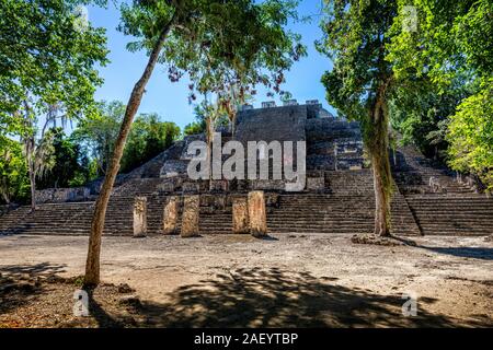 Mother and son walk down a pyramid at Calakmul Archaeological Site in Campeche, Mexico. Stock Photo