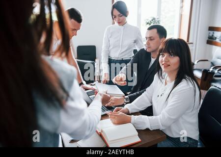 Results of the testing. Business people and manager working on their new project in classroom Stock Photo