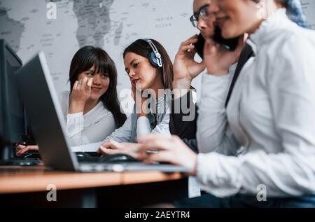 Employees have conversation. Young people working in the call center. New deals is coming Stock Photo