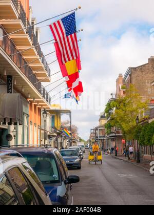 New Orleans, USA. December 2019. Row houses of traditional architecture in Louisiana city on street sidewalk at French Quarter Stock Photo