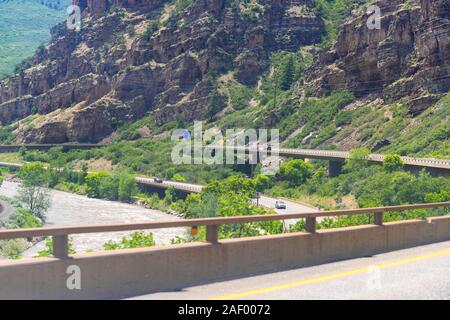 Glenwood Springs, USA - June 29, 2019: Glenwood Canyon on i70 interstate freeway highway through Colorado towns with cliffs and cars in traffic on roa Stock Photo