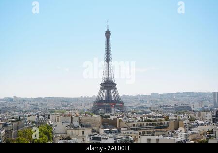 Eiffel Tower rises above the city of Paris, seen across the rooftops from the Arc de Triomphe Stock Photo