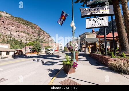 Ouray, USA - September 13, 2019: Small town in Colorado with city main street and wide angle view of inn hotel sign historic architecture flag Stock Photo
