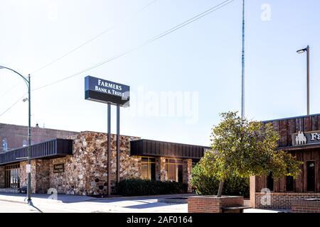 Larned, USA - October 14, 2019: Small town city in Kansas with exterior of building for small local farmers bank and trust Stock Photo