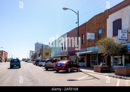 Larned, USA - October 14, 2019: Small city in Kansas with downtown main street historic architecture buildings stores shops Stock Photo