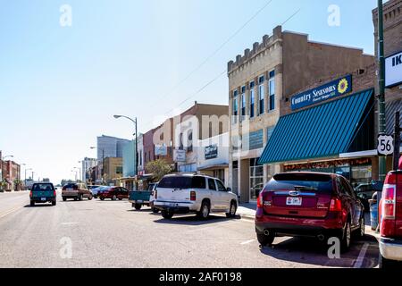 Larned, USA - October 14, 2019: Small town village city in Kansas with downtown main street historic architecture buildings stores shops Stock Photo