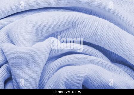 Classic blue knitted fabric wool texture for background. Close up of blue knitted material pattern for design. Blue warm sweater textile background Stock Photo