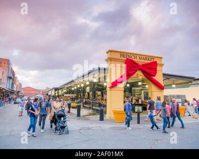 New Orleans, USA. December 2019. Frontage to the French Market (also Farmer's Market) in the French Quarter during Chritmas time. Visitors enter and e Stock Photo