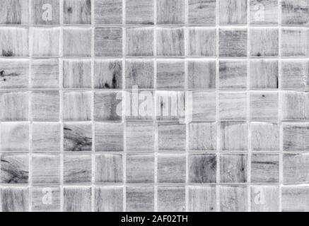 White ceramic mosaic tiles with a wood pattern. Tile texture. Stock Photo