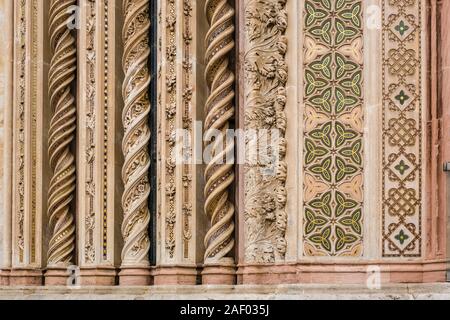 Detail of artful rock carvings of the gothic facade of Orvieto Cathedral