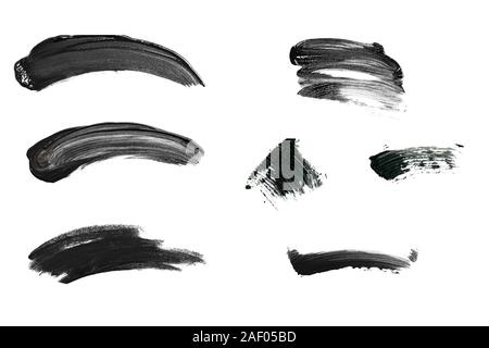 Set of black color smudges isolated on white background. Cosmetics or artistic paint strokes. Stock Photo