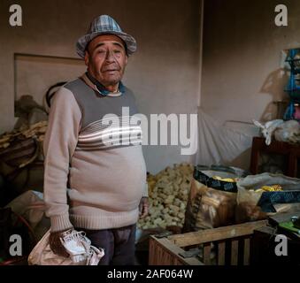 MARAS, PERU - CIRCA SEPTEMBER 2019:  Portrait of Peruvian man inside his home on the village of Maras, near Cusco in region known as Sacred Valley Stock Photo